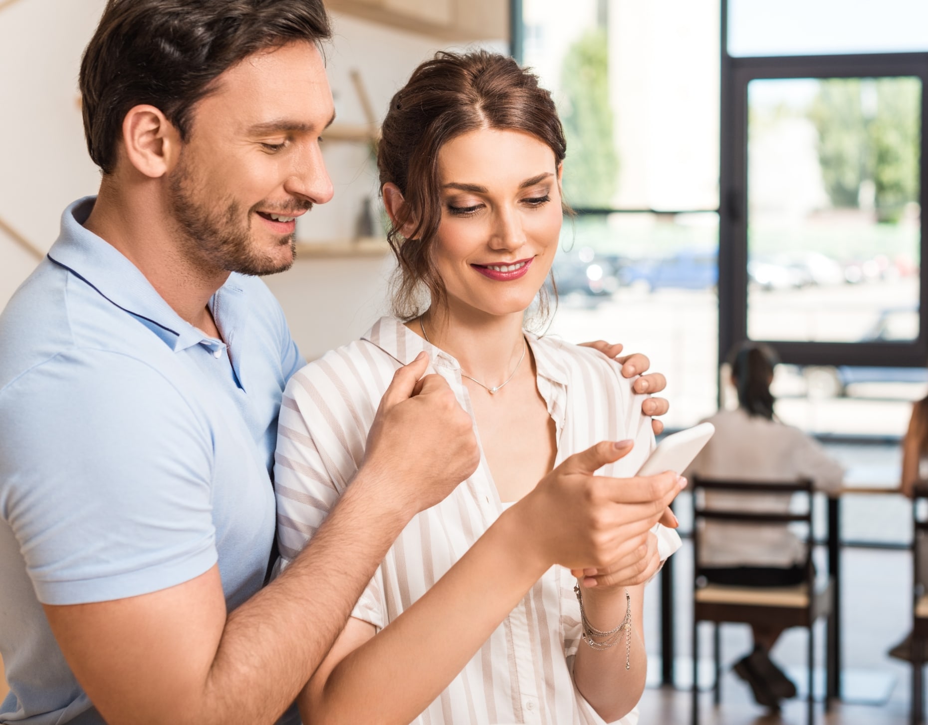A couple looking at a mobile phone